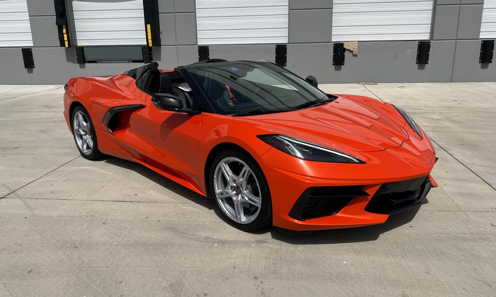 Black 2021 Chevrolet Corvette convertible parked on a rooftop garage