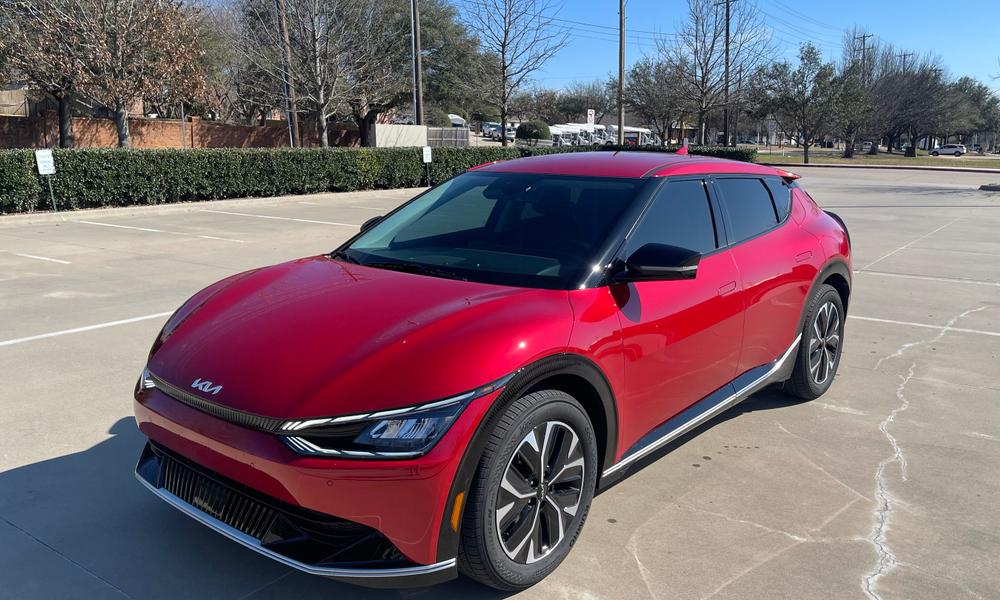 Red 2022 Kia EV6 electric crossover in a parking lot